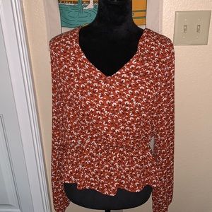 Burnt orange floral blouse